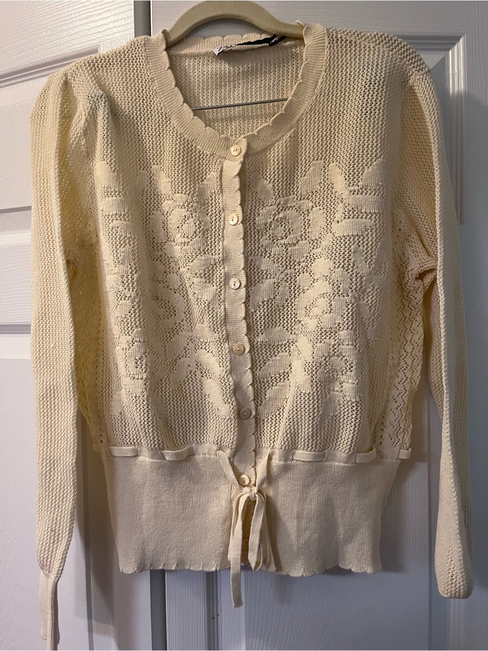 Cream Knit Floral Cardigan Sweater with Tie Waist and Openwork Crochet Detail